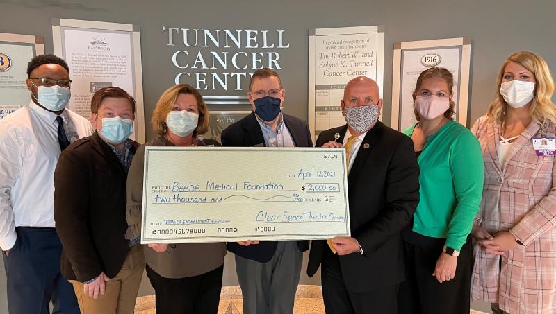 Check presentation attendees shown are (l-r) Beebe Healthcare Oncology Services Executive Director Maurice Winkfield, Clear Space Theatre Artistic Director David Button, Beebe Healthcare Director of Patient Care Services Susan McCauley, Clear Space Theatre Executive Director Wesley Paulson, Beebe Medical Foundation President Tom Protack, Clear Space Theatre Director of Development and Outreach Stephanie Hudson Whitcomb, and Beebe Healthcare Oncology Services Care Coordinator Amanda Aris. SUBMITTED PHOTO